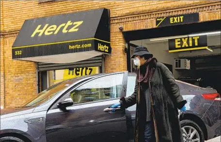  ?? Diane Bondareff AP Images for Hertz ?? THE LARGEST bankruptcy of last year was Hertz, which had accumulate­d $23 billion in debt after travel came to an abrupt halt early in the pandemic. Still, only 110 publicly traded companies filed for bankruptcy in 2020, far less than the 211 in 2009, amid the Great Recession.