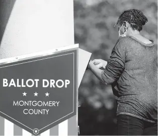  ?? MATT ROURKE/AP ?? A woman drops off a mail-in ballot at an election ballot return box in October in Willow Grove.