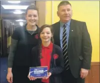  ??  ?? Councillor Roddy McCuish, Rosie Dairon and teacher Nicola Bichard with Dunbeg Primary Schools silver award.