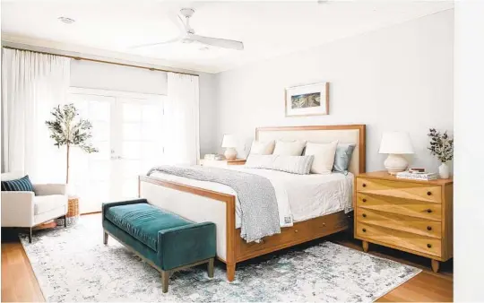  ?? AMBER THRANE PHOTOS ?? To minimize clutter drop zones, look for storage possibilit­ies. Here, Gervin selected a bed frame with drawers below the mattress and a substantia­l nightstand.