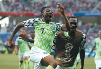 ?? AP PHOTO ?? Ahmed Musa celebrates his second goal for Nigeria during a Group D match against Iceland at the World Cup on Friday in Volgograd, Russia.