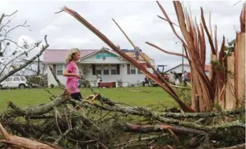  ?? GARY COSBY JR./THE ASSOCIATED PRESS ?? An apparent tornado struck a rural area of northwest Alabama, toppling trees and damaging homes.