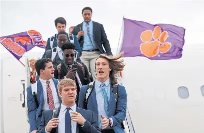  ?? GERALD HERBERT THE ASSOCIATED PRESS ?? The Clemson Tigers and Trevor Lawrence, right front, face the LSU Tigers in the College Football Playoff title game on Monday.