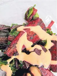  ?? DENISE MILLER/FOR THE JOURNAL ?? Roast the beets and steam their greens before topping with a Creamy Red Chile Dressing.