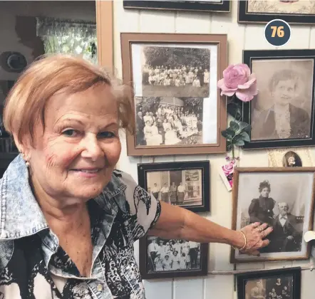  ?? TREASURE TROVE: Pat Keenan Carr proudly displays some of the photograph­s from bygone times she has collected. ??