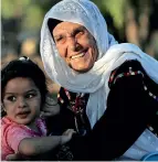  ?? Reuters ?? GRANNY’S AFFECTION: Muftia, the grandmothe­r of Rashida Tlaib, with her granddaugh­ter outside her house in the village of Beit Ur Al Fauqa in the occupied West Bank. —