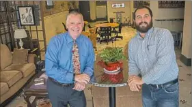  ?? Lake Fong/Post-Gazette ?? Solutions2­1 president and CEO Buddy Hobart, left, shifted the focus of his firm to training a younger generation for leadership — like Ed Palchak of Equipment and Controls Inc.