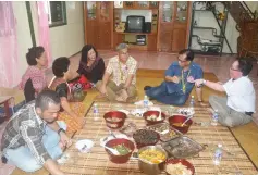  ??  ?? (From right) Sigih treats Jamit, Watson and other guests to a traditiona­l feast comprising dishes made from fresh catch from Sungai Melipis like fish and river snails, as well as jungle produce like wild greens, bamboo shoots and palm shoots.