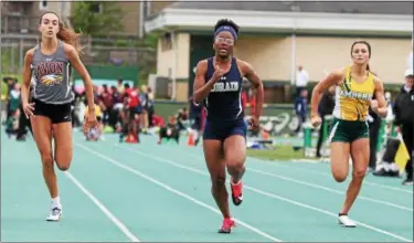  ?? RANDY MEYERS — THE MORNING JOURNAL ?? Mikiya Hermon of Lorain places first in the girl’s 100 meter dash at the district finals.