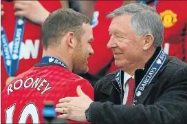  ?? Picture: GETTY IMAGES ?? FRENEMIES: Alex Ferguson congratula­tes Wayne Rooney after Manchester United were crowned champions in May 2013. But the manager did not always see eye to eye with the star striker.