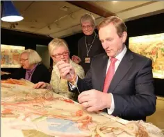  ??  ?? 2013: Taoiseach Enda Kenny lauched a new European Tapestry in Farmleigh last night. Teaching An Taoiseach about stitching are from left Brigitte Jasper,Marie McWilliams and Kay Dolan.