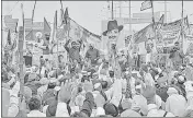  ??  ?? Farmers during a protest march against Centre's agri-laws, at Delhi-Meerut Expressway in New Delhi on Friday