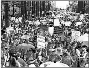  ?? ROSS D. FRANKLIN/AP ?? Thousands march Thursday to the Arizona Capitol to demand higher teacher pay and increased school funding.