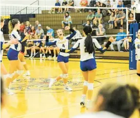  ?? COLIN MURPHY/FOR BALTIMORE SUN MEDIA ?? Liberty volleyball players celebrate after winning the first set, 25-13, against Francis Scott Key on Monday. The No. 12 Lions won in straight sets to improve to 2-0.