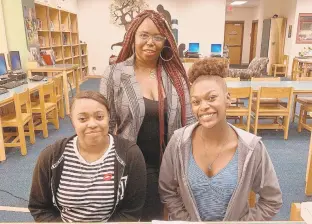  ?? COURTESY OF WINTER SAVAGE ?? Winter Savage, center, poses with Diamond McKinnon and Taquira Reid at a Pre-Prom Pop Up hosted by Fashion for Awareness. The event connects Oscar Smith High School students with prom resources.