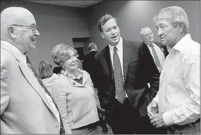  ??  ?? Inductee David Snowden Sr. with his wife, Judy, and his son David Snowden Jr.,
also an inductee, and artist Phillip Crowe