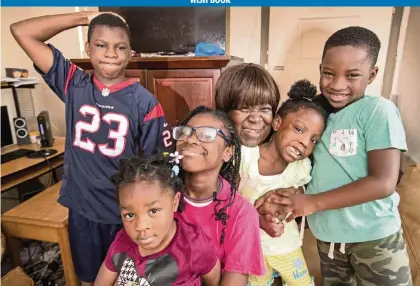 ?? AL DIAZ adiaz@miamiheral­d.com ?? Joan Pratt, 62, gathers her grandchild­ren, from left, Isiah, 13, Abigail, 3, Oliviea, 10, Terylin, 5, and Loyal, 6, this month at their Liberty City home. The family could use some new furniture, especially beds, and other items.