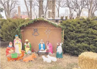  ?? RUSSELL CONTRERAS/ASSOCIATED PRESS ?? A Nativity scene is displayed next to a public park in the farming community of McClave, Colo. Some communitie­s have balked at demands to remove the public displays.