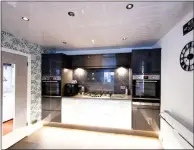  ?? ?? The sleek and modern designed kitchen