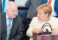  ?? JOHN MACDOUGALL/AGENCE FRANCE-PRESSE ?? German Chancellor Angela Merkel and German Interior Minister Horst Seehofer at the start of a CDU/CSU parliament­ary group meeting on Tuesday in Berlin.