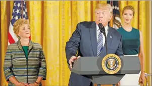  ?? AP PHOTO ?? President Donald Trump, flanked by Small Business Administra­tion Administra­tor Linda McMahon, left, and his daughter Ivanka Trump, speaks in the East Room of the White House in Washington, Tuesday.