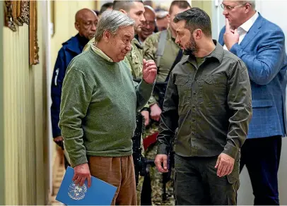  ?? AP ?? UN Secretary-General Antonio Guterres, left, and Ukrainian President Volodymyr Zelenskyy leave a news conference during their meeting in Kyiv.