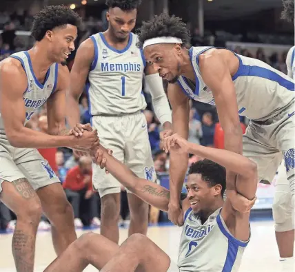  ?? PETRE THOMAS/USA TODAY SPORTS ?? Memphis guard Jayden Hardaway and forward Deandre Williams react with guard Elijah Mccadden after a charge call during the second half against Temple at Fedexforum.