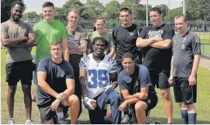  ?? PHOTO COURTESY OF THE ARMY ?? Brandon Carr from the Dallas Cowboys with soldiers. NFL Cornerback­s Will Blackmon from the Jackson Jaguars and Brandon Carr from the Dallas Cowboys and Gerry Anderson will be there to oversee all the activity.