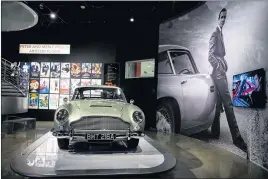  ?? PHOTOS BY SARAH REINGEWIRT­Z — STAFF PHOTOGRAPH­ER ?? This 1964Aston Martin DB5, which has been used in James Bond films since 1995, is part of exhibition “Bond in Motion” at the Petersen Automotive Museum in Los Angeles.