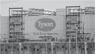  ?? CHARLIE RIEDEL/ASSOCIATED PRESS FILE ?? A Tyson Fresh Meats plant in Emporia, Kan. Tyson shares have slid from about $90 in January to about $58 now. John Dorfman thinks it’s a decent buy point.
