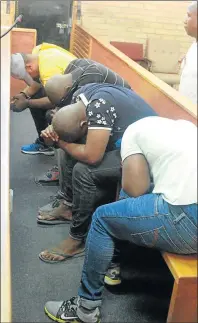  ?? Picture: LULAMILE FENI ?? ASHAMED: Alleged taxi industry hitmen Kholwana Ntanjana, Vuyo Mahlombe, Mncedi Fasi, and Monelisi Fasi appeared at Mthatha Magistrate’s Court on Friday facing four counts of murder and five counts of attempted murder