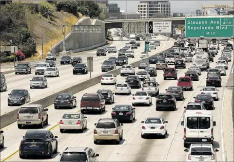  ?? Al Seib Los Angeles Times ?? PRESIDENT TRUMP has rejected the 2015 Paris agreement to mitigate greenhouse gas emissions. Above, traffic clogs the 405 Freeway.