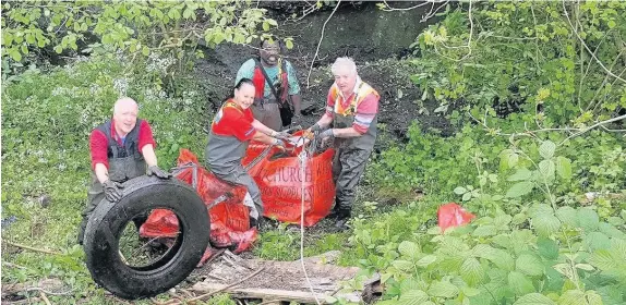  ??  ?? Volunteers from Cardiff Rivers Group cleared four tonnes of bulky waste from a stream in the Llanishen area of the city