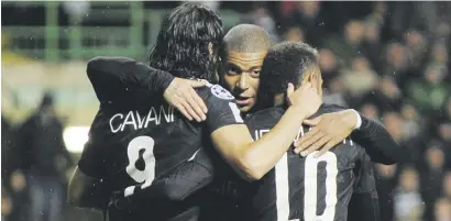  ?? Picture: AFP ?? CLASSY TRIO. PSG’s Edinson Cavani, left, celebrates with team-mates Kylian Mbappe and Neymar after scoring their third goal during their Uefa Champions League Group B match against Celtic in Glasgow last night.