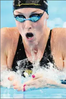  ?? ?? Marrit Steenberge­n of the Netherland­s swims in a women’s 200-meter medley semi-final at the World Aquatics Championsh­ips in Doha, Qatar, Sunday, Feb. 11, 2024. (AP)