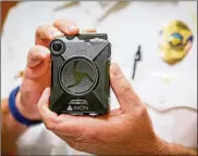  ?? GREG LYNCH/STAFF ?? West Chester Twp. police will be sporting a new piece of equipment soon, an Axon body camera, now that trustees approved the purchase of 50. Dayton police still don’t have them.