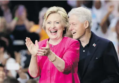  ?? MATT SLOCUM / THE ASSOCIATED PRESS ?? Hillary Clinton, shown with husband Bill at a campaign rally in July, is facing questions over donations made to her Clinton Foundation while she was working at the State Department.