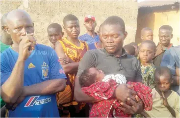  ?? Photo: Umar Muhammed ?? The abandoned baby held by Mr Sule yesterday in Lafia