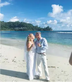  ?? (Facebook) ?? MK KSENIA SVETLOVA and her husband, Anatoly Aliev, stand on a Seychelles beach after their wedding earlier this week.