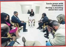  ?? ?? Lucio prays with lawmakers during a meeting about her case