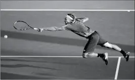  ?? ASSOCIATED PRESS ?? Ruben Bemelmans, of Belgium, returns a shot from Lucas Pouille, of France, during the first round of the U.S. Open tennis tournament Monday in New York.