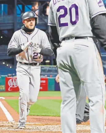  ?? Gene J. Puskar, The Associated Press ?? Rockies’ Trevor Story crosses the plate after hitting a three-run home run in the fourth inning in Pittsburgh on Monday night.