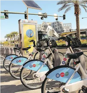  ??  ?? RTC Bike Share users can check out a bike from one station and return it to another station downtown near their final destinatio­n.