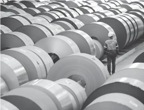  ?? JEAN-CHRISTOPHE VERHAEGEN/AFP/GETTY IMAGES ?? Coils of steel are stored in steel giant ArcelorMit­tal’s plant in Florange, France. Canadian steel firms like ArcelorMit­tal Dofasco, a unit of ArcelorMit­tal, have seen few signs of whether the U.S. will grant them an exemption extension for tariffs.