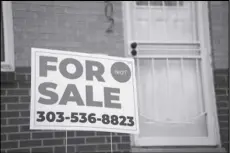  ?? ASSOCIATED PRESS ?? A for sale sign stands outside a single-family residence on Nov. 23 in Denver. On Thursday, Freddie Mac reported on this week’s average US mortgage rates.