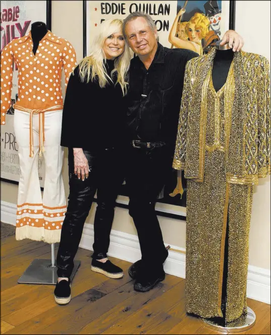  ?? Tonya Harvey Real Estate Millions ?? In their home, Catherine Hickland and Todd Fisher have displayed costumes that his mother and sister wore onstage.