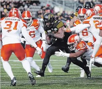  ?? PETER POWER THE CANADIAN PRESS ?? Hamilton Tiger-Cats wide receiver Bralon Addison (86) draws a crowd during last weeks divisional semifinal.