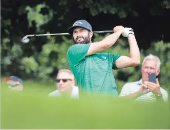  ?? NATHAN DENETTE THE CANADIAN PRESS ?? Canadian Adam Hadwin watches his tee shot on the seventh hole during the pro-am ahead of the Canadian Open golf tournament at the Glen Abbey Golf Club in Oakville on Wednesday.