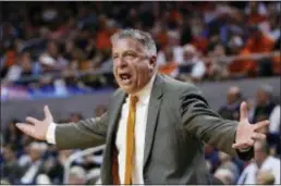  ?? BRYNN ANDERSON — THE ASSOCIATED PRESS FILE ?? Auburn head coach Bruce Pearl reacts on the sidelines during a game against South Carolina. Pearl has led Auburn to its first NCAA Tournament in 15 years but still faces questions about his job security amid an internal review of the program.