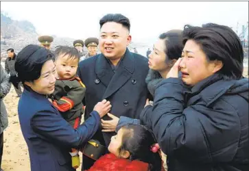  ?? Photograph­s by Korean Central News Agency ?? KIM JONG UN, shown visiting a soldier’s family in 2013, has not been seen in public since April 11, giving rise to rumor. Informatio­n about the leader’s health is a secret that only a few people in North Korea would know.